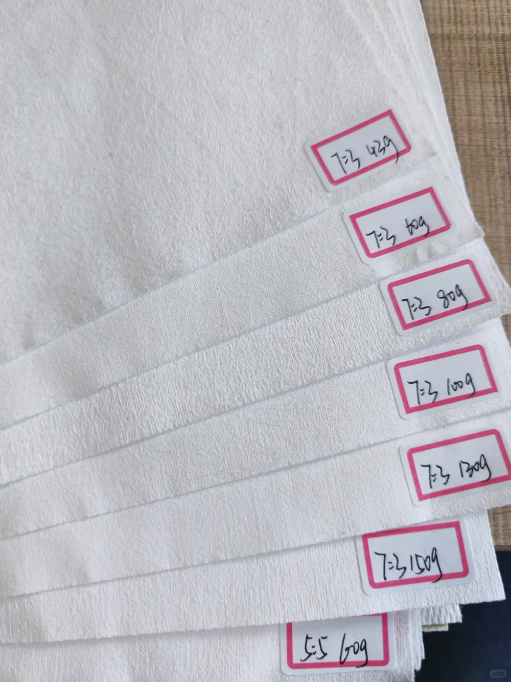 Non-woven fabric samples in different GSM weights from 42 to 150 gsm