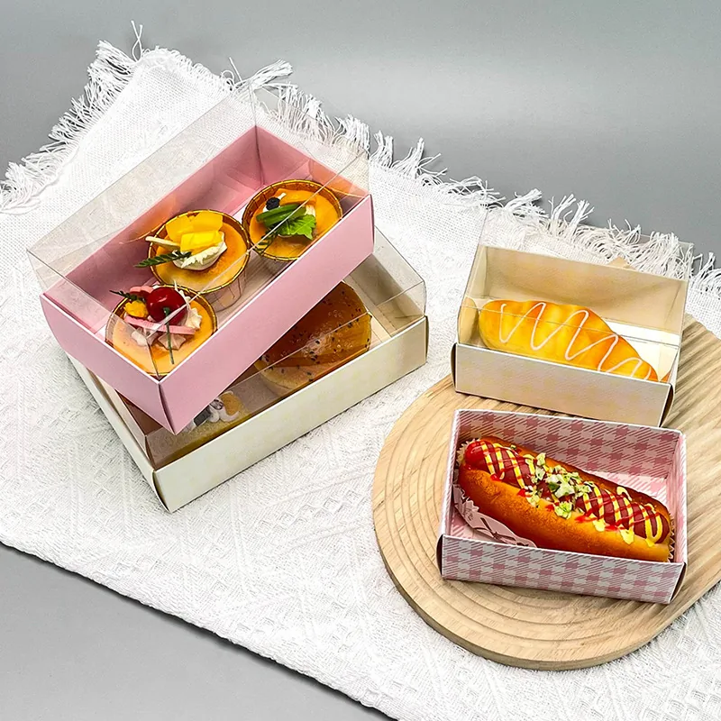 Two-piece lid and base pastry boxes with clear lids holding desserts and baked goods