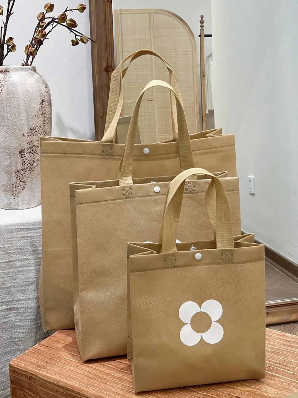 Custom non-woven tote bags in three different sizes
