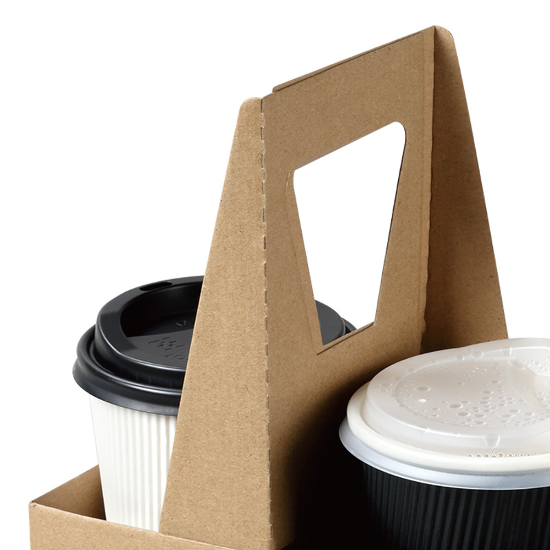 Comfortable handle on a cup carrier spreading drink weight